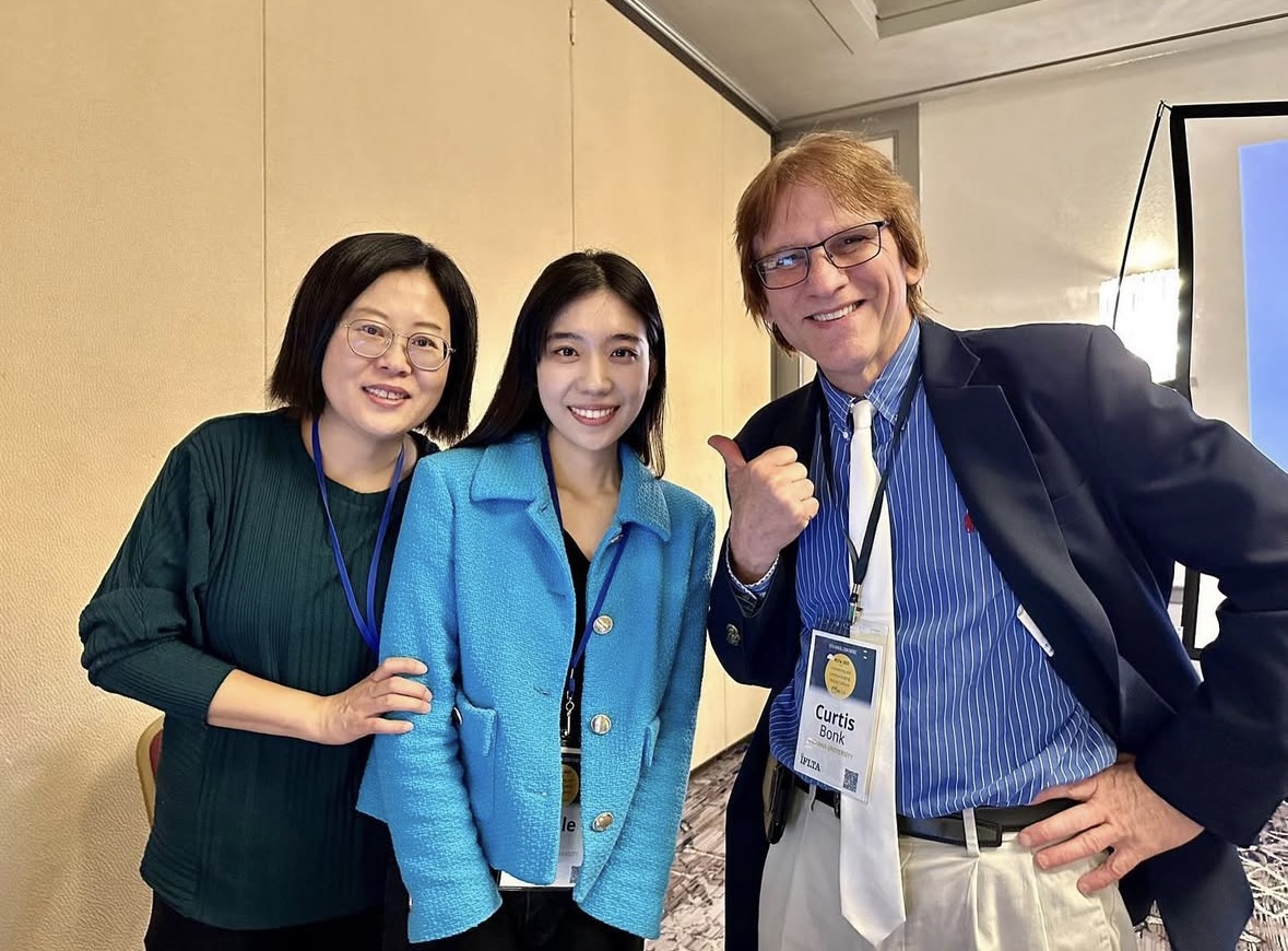 Belle Li with faculty collaborators during an AECT conference gathering
