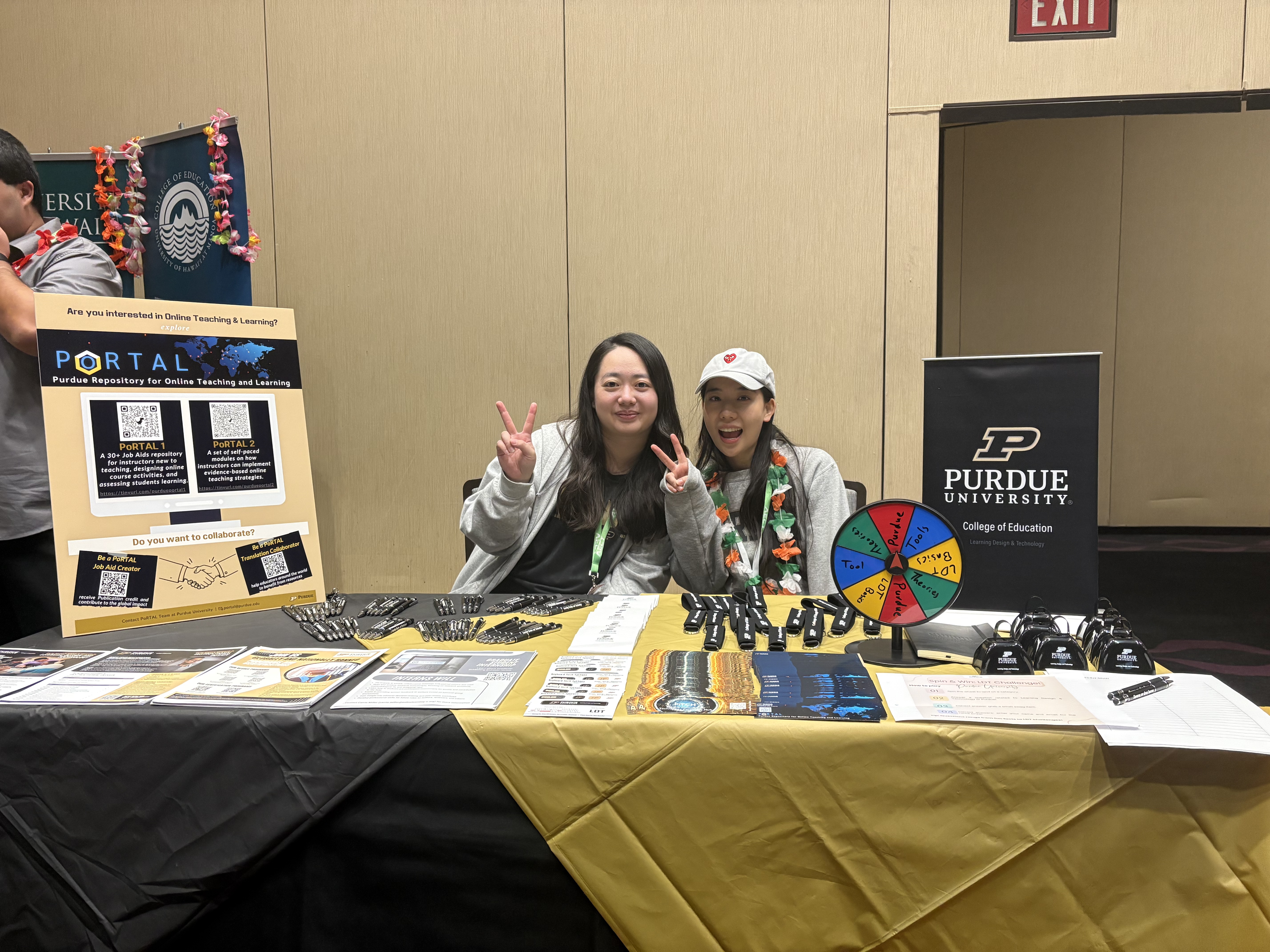Belle Li representing Purdue College of Education at an AECT university reception table